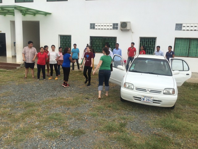 Teachers having fun before class in front of the Peace Christian School Building