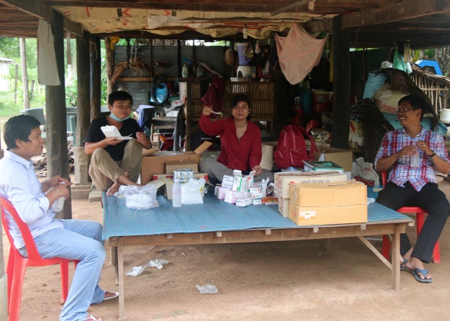 L to R, Dr. Rada, Dr. Sela, Sreynang, and Dr. Tola take a lunch break at the pharmacy area